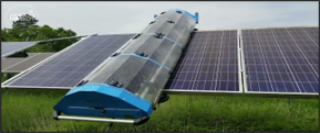 solar panel being cleaned by heavy machine